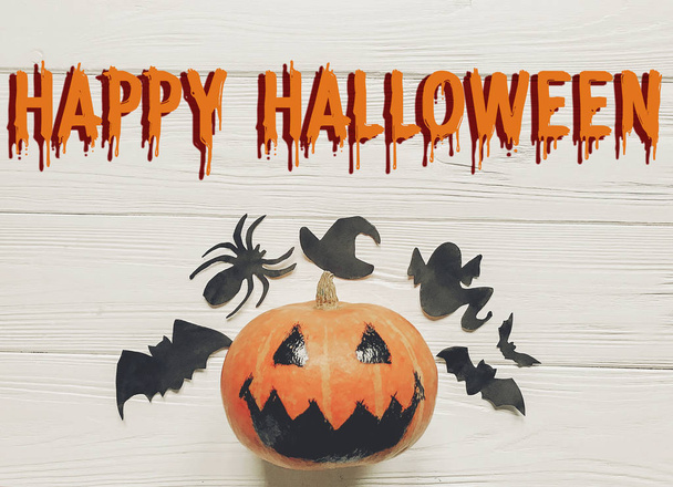 happy halloween text flat lay. jack lantern pumpkin  - Фото, изображение