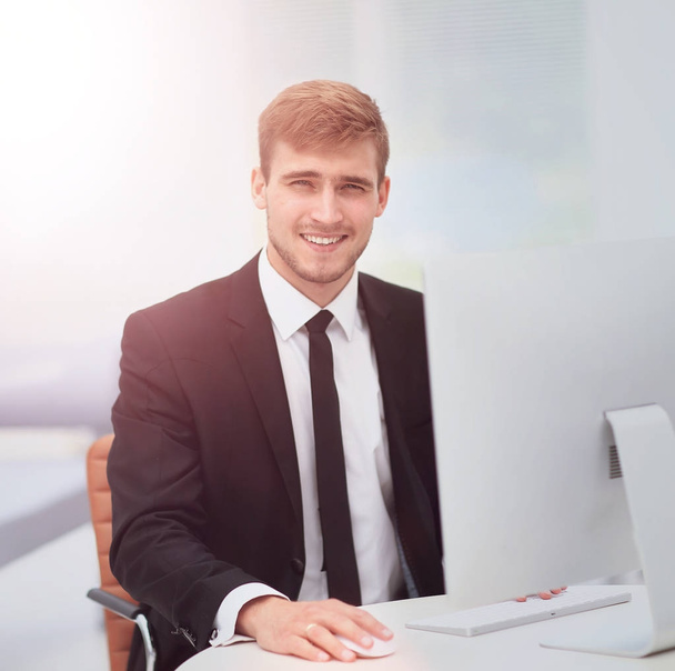 Portrait of happy businessman  at the workplace - Фото, изображение