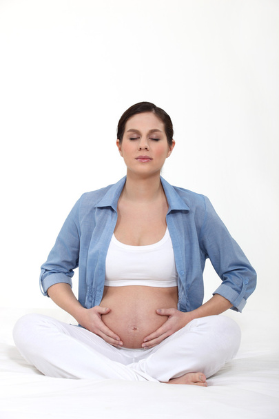 Pregnant woman practising yoga - Foto, Imagem
