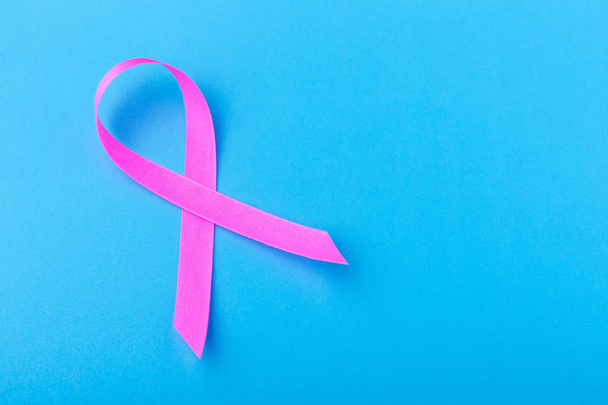Breast Cancer concept : Pink ribbon symbol of breast cancer on b - Fotó, kép
