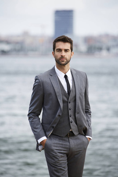 Serious businessman in grey suit - Zdjęcie, obraz