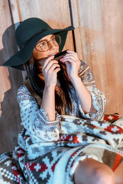 hippie girl playing harmonica - Photo, Image