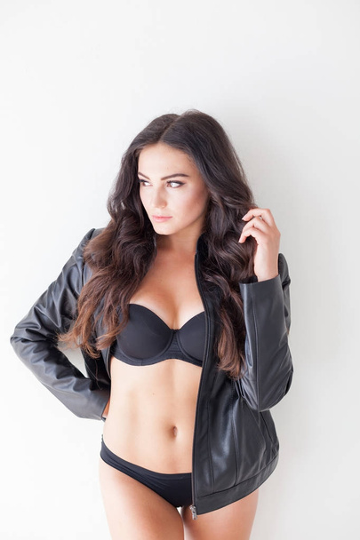 brunette girl in leather jacket and black lingerie - Fotografie, Obrázek