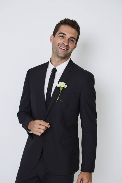 Happy groom in smart black suit  - Фото, изображение