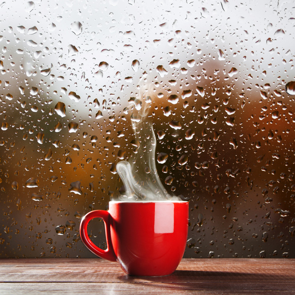 Cup of coffee on a rainy day - Photo, Image