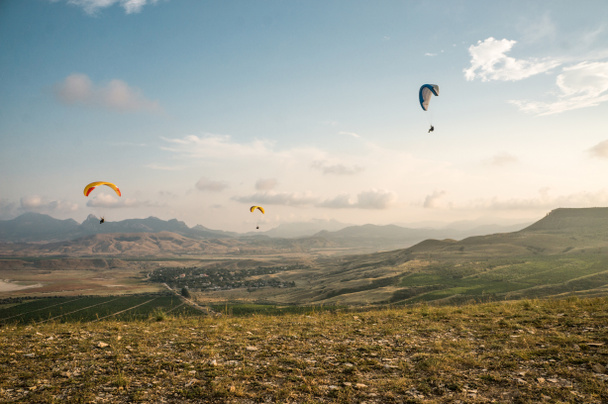 people flying on paragliders - Photo, Image