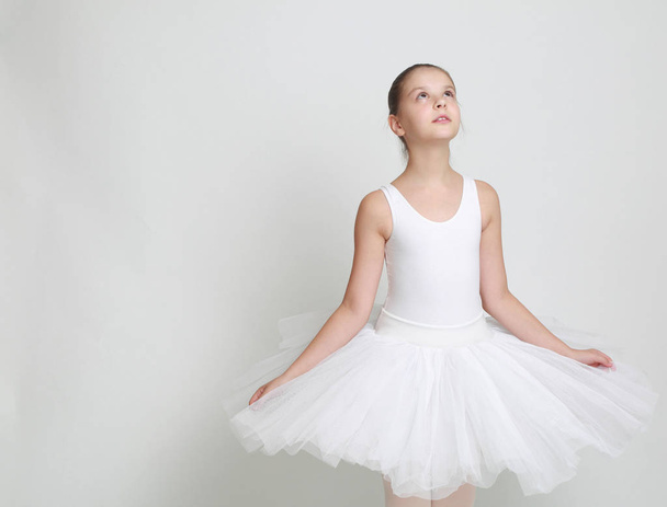 Beautiful little ballerina in studio - Fotoğraf, Görsel
