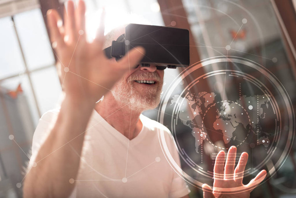 Man using a virtual reality headset, double exposure, light effe - Photo, Image