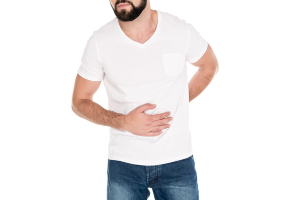 man having stomach ache - Foto, afbeelding