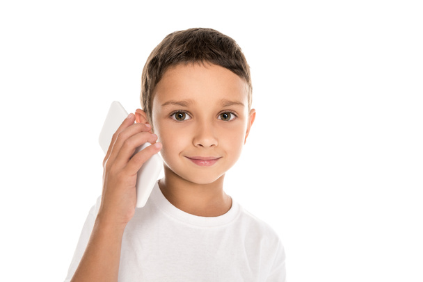 little boy talking on smartphone - Foto, afbeelding