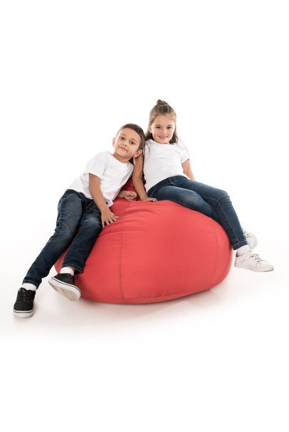 children resting on bag chair - Photo, Image