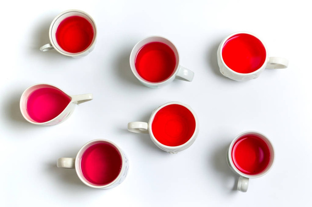 Red herbal tea in cups on white background - Photo, Image