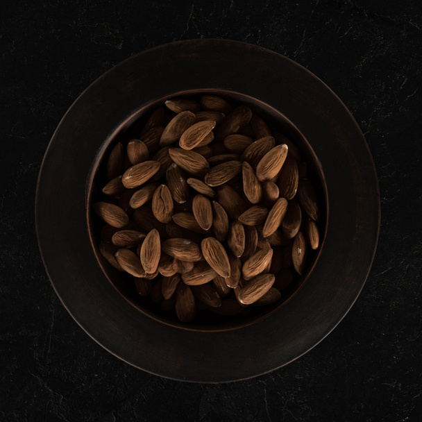 almonds on plate - Фото, изображение