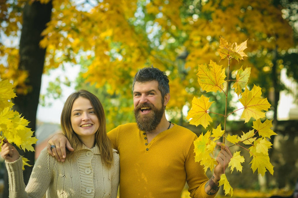 Autumn happy couple of girl and man outdoor. - Zdjęcie, obraz