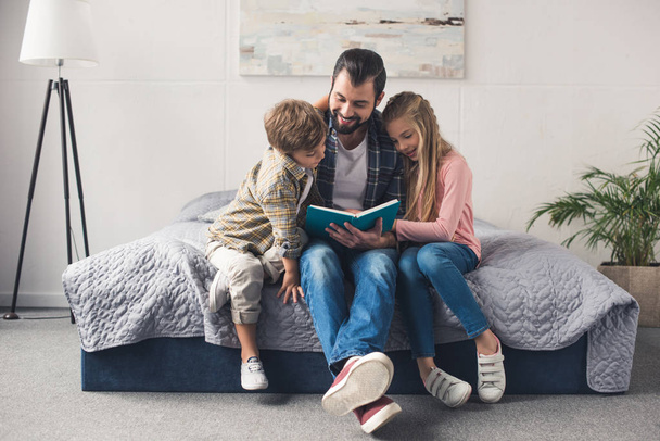 family reading book together - Photo, Image