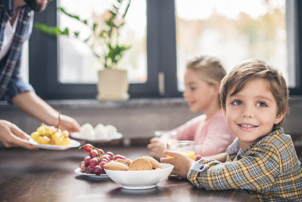 little boy having breakfast with family - Photo, Image