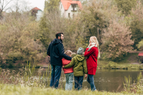 young family near lake - Fotografie, Obrázek