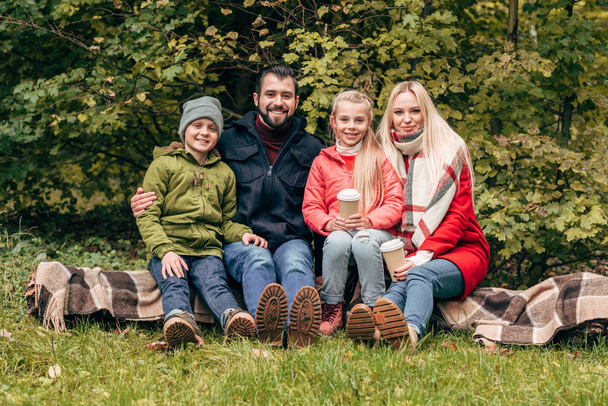 family with paper cups in park - Photo, image