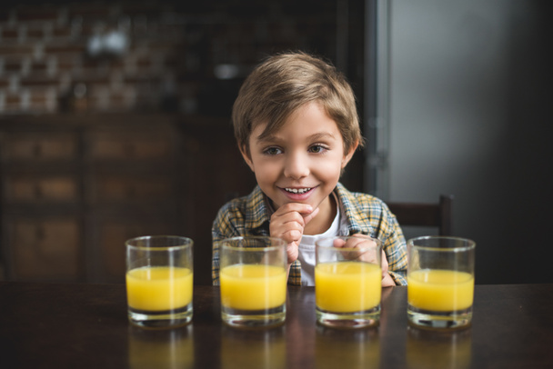 boy with glasses of juice - Фото, зображення