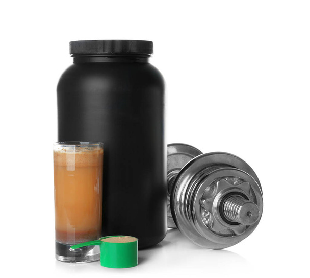 Jar, protein shake and dumbbell on white background - Photo, image