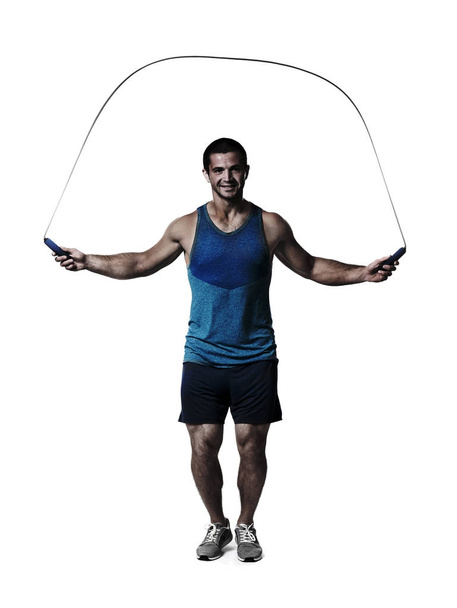 Young man with jumping rope on white background - Foto, Imagem