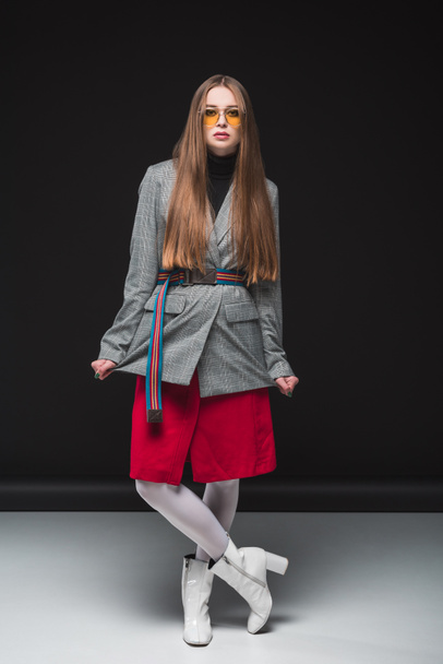 woman in gray jacket and red skirt - Valokuva, kuva