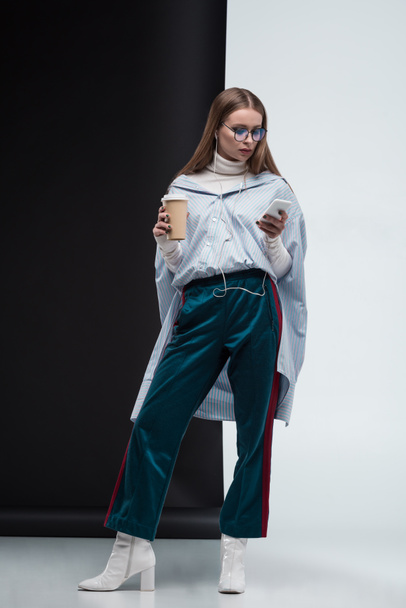 Stylish girl with smartphone and coffee  - Valokuva, kuva