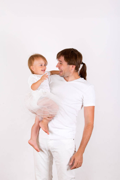 Father and baby girl in white photography in the Studio - Φωτογραφία, εικόνα