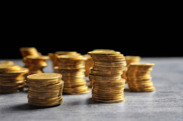 Stacked coins on table - Photo, image