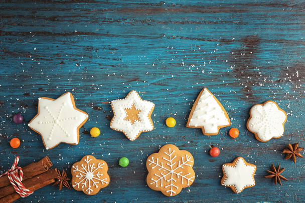 Creative Christmas cookies on wooden background - 写真・画像