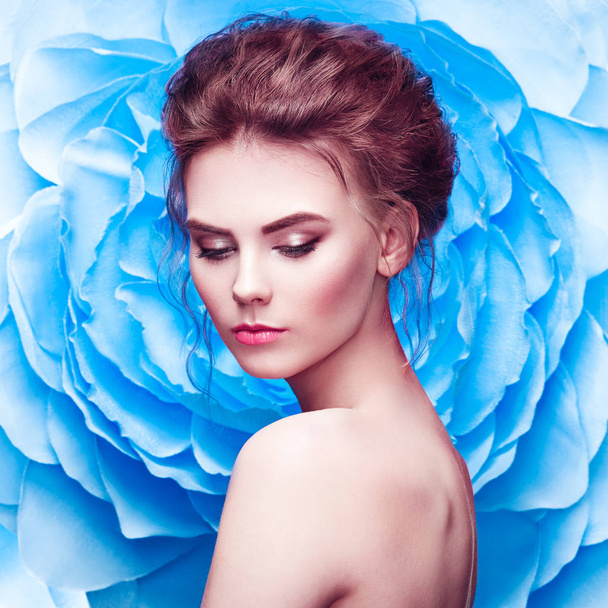 Beautiful woman on the background of a large flower - Photo, image