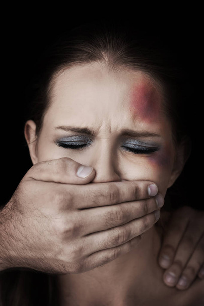 Young woman subjecting to violence - Фото, зображення