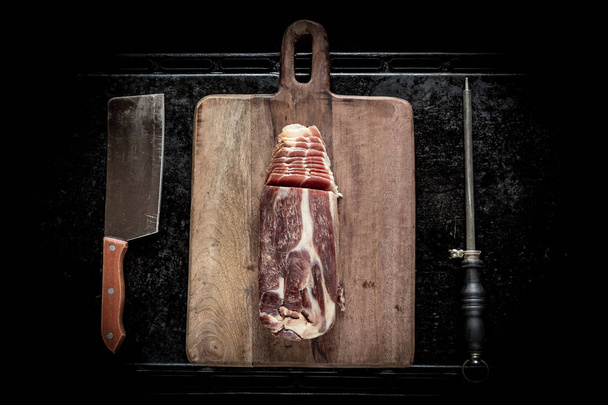 Sliced Jamon on a wooden board - Фото, зображення