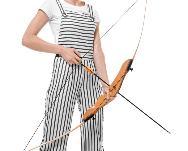 Young female archer with bow on white background - Foto, Imagen
