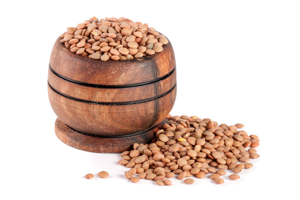 Lentils in a wooden bowl isolated on a white background - Photo, Image