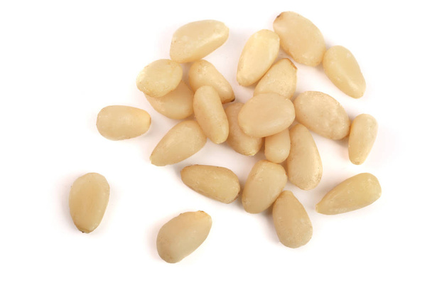 Shelled cedar pine nuts isolated on white background. top view - Photo, image