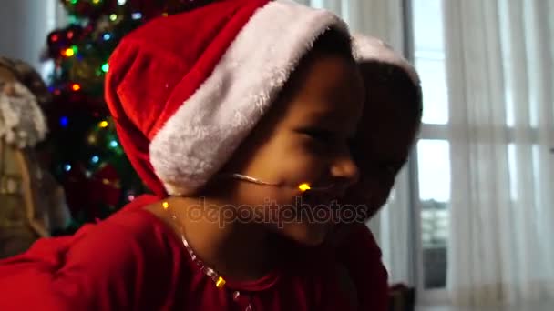 Children playing with Christmas lights - Video