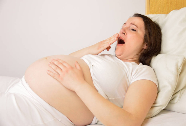pregnant woman tired  - Фото, изображение