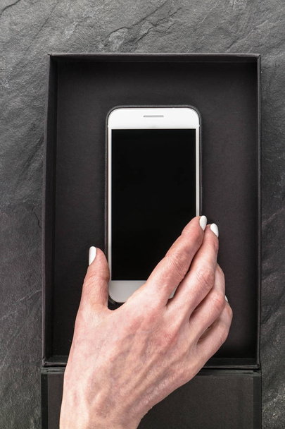 Black Friday, box and phone in hand close-up - Valokuva, kuva