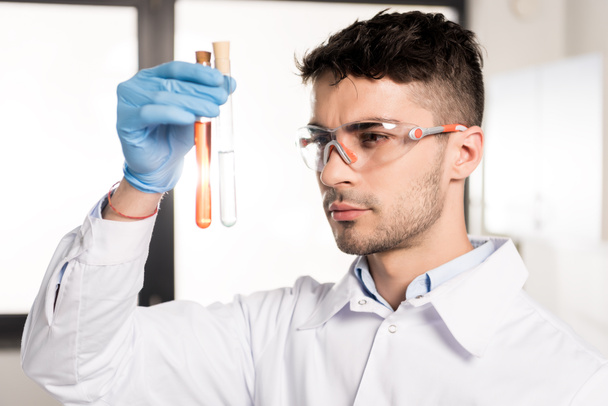 scientist holding test tube - Фото, изображение