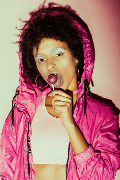 afro 80s girl with lollipop - Foto, afbeelding