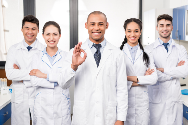 Doctor with team showing ok sign - Photo, Image
