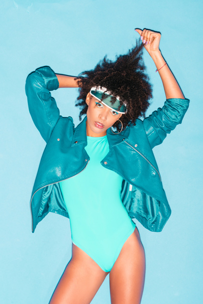 model posing in turquoise bodysuit  - Foto, Bild