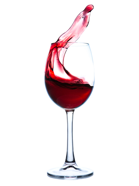 Червоне вино бризкає в склянці
  - Фото, зображення