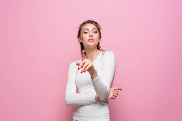 The serious frustrated young beautiful business woman on pink background - Fotoğraf, Görsel