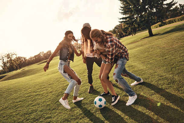 four friends playing soccer - Foto, Bild