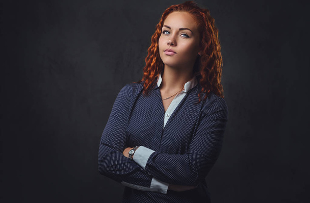 Redhead female supervisor dressed in an elegant suit. - Foto, Imagem
