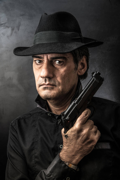 man with gun and serious look - Photo, Image