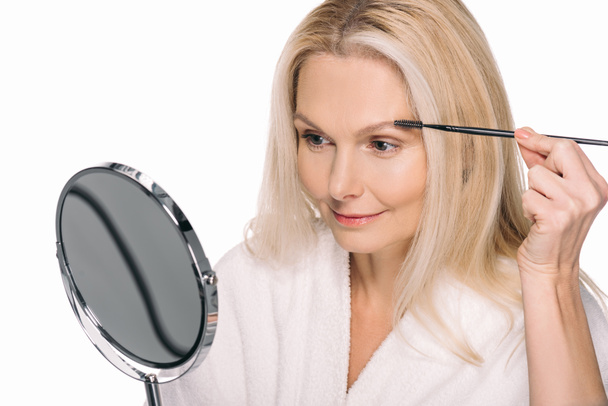 mature woman using eyebrow brush - Φωτογραφία, εικόνα
