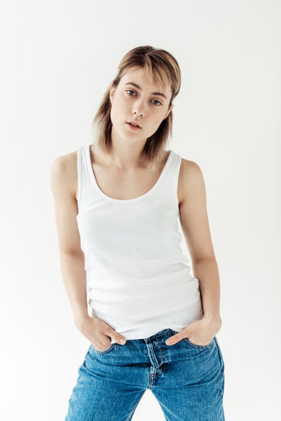 woman in white singlet and blue jeans - Fotoğraf, Görsel